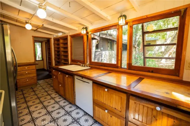 a bathroom with a toilet and a shower curtain