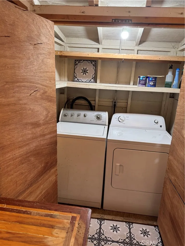 0 Hot Springs Canyon Road, Unit 26 San Juan Capistrano, CA 92675 - Photo 48 of 59 a utility room with dryer and washer