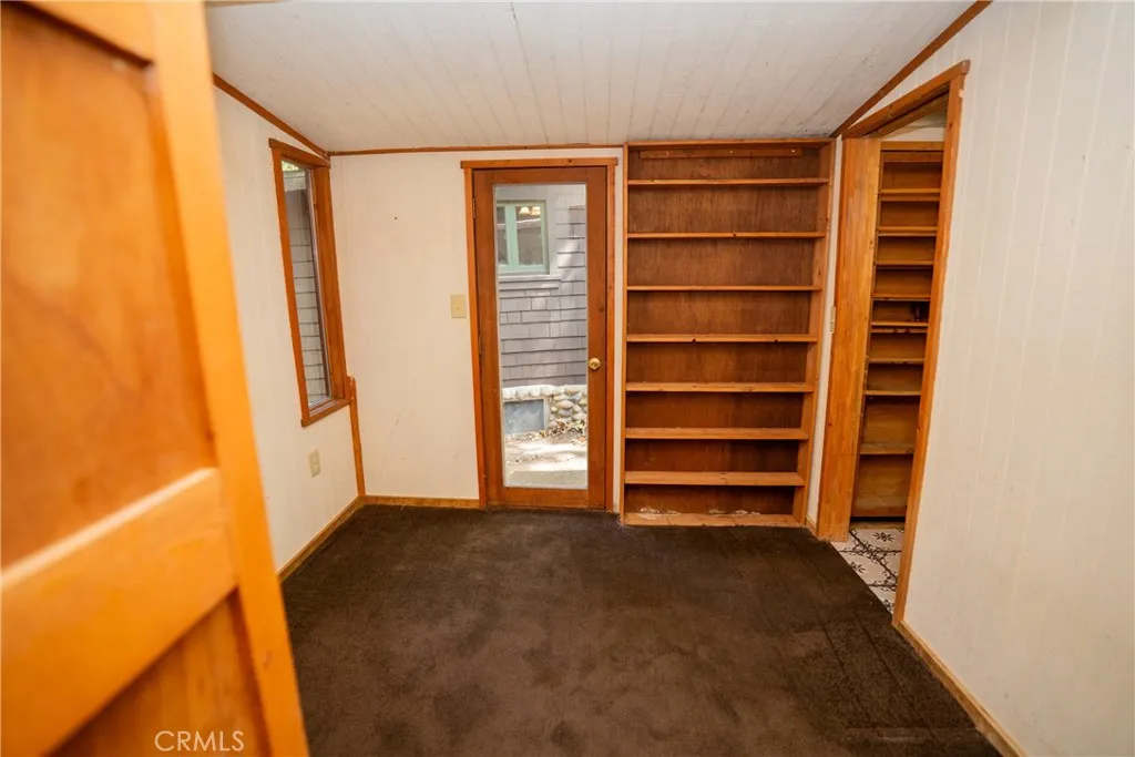 0 Hot Springs Canyon Road, Unit 26 San Juan Capistrano, CA 92675 - Photo 56 of 59 a view of walk in closet with empty racks