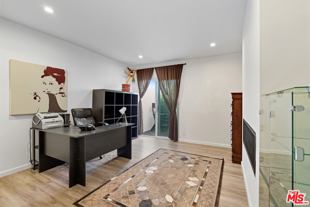 10915 Ayres Avenue Los Angeles, CA 90064 - Photo 14 of 51 a view of a workspace with furniture and a window