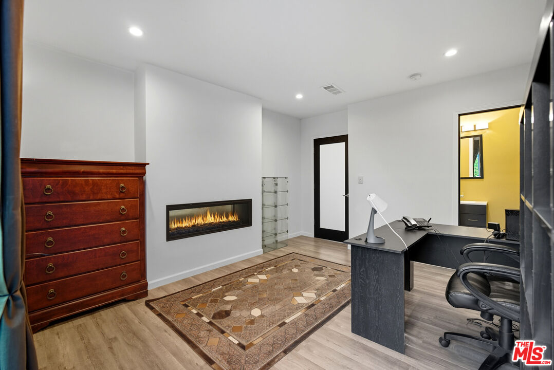 10915 Ayres Avenue Los Angeles, CA 90064 - Photo 15 of 51 a living room with couch and a flat screen tv