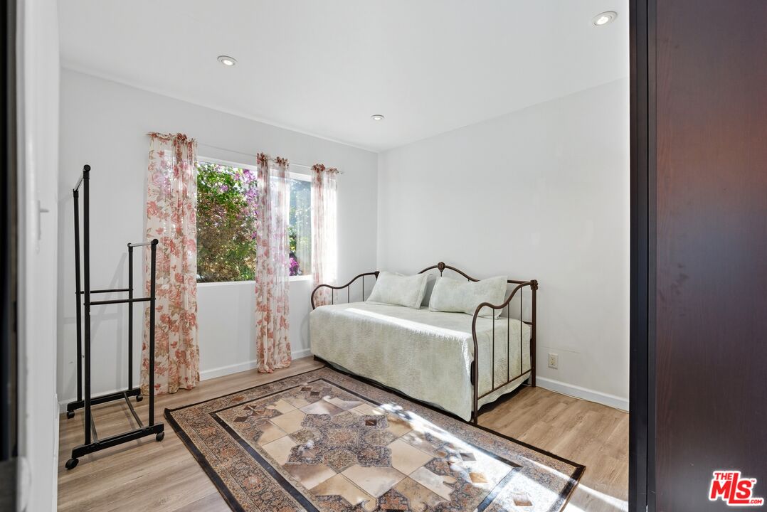 10915 Ayres Avenue Los Angeles, CA 90064 - Photo 25 of 51 a living room with furniture and a open refrigerator