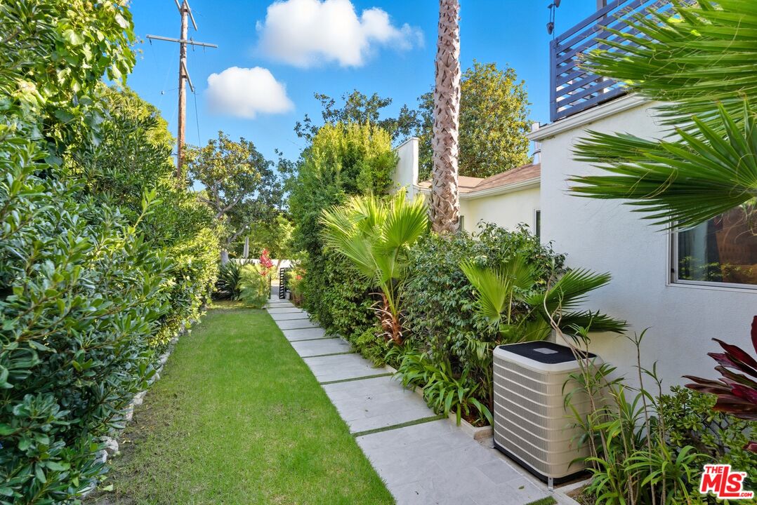 10915 Ayres Avenue Los Angeles, CA 90064 - Photo 29 of 51 a backyard of a house with a garden and outdoor seating