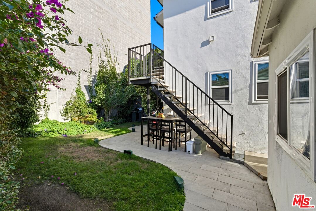 10915 Ayres Avenue Los Angeles, CA 90064 - Photo 33 of 51 a view of a house with a yard