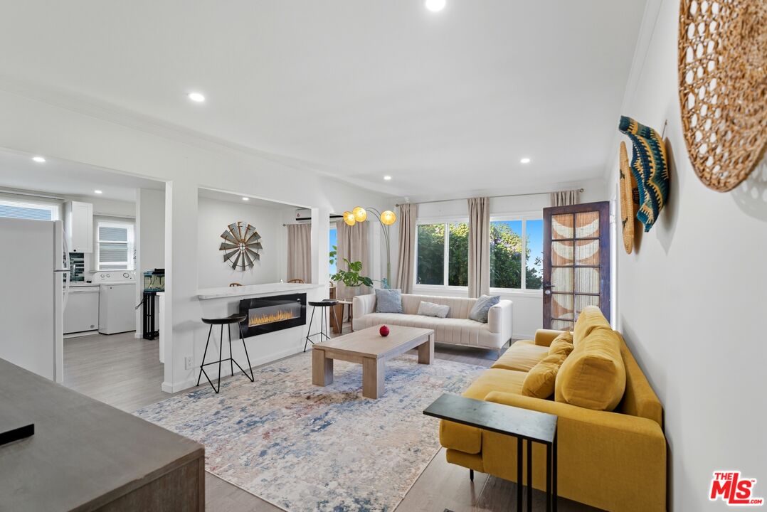10915 Ayres Avenue Los Angeles, CA 90064 - Photo 35 of 51 a living room with furniture and a large window