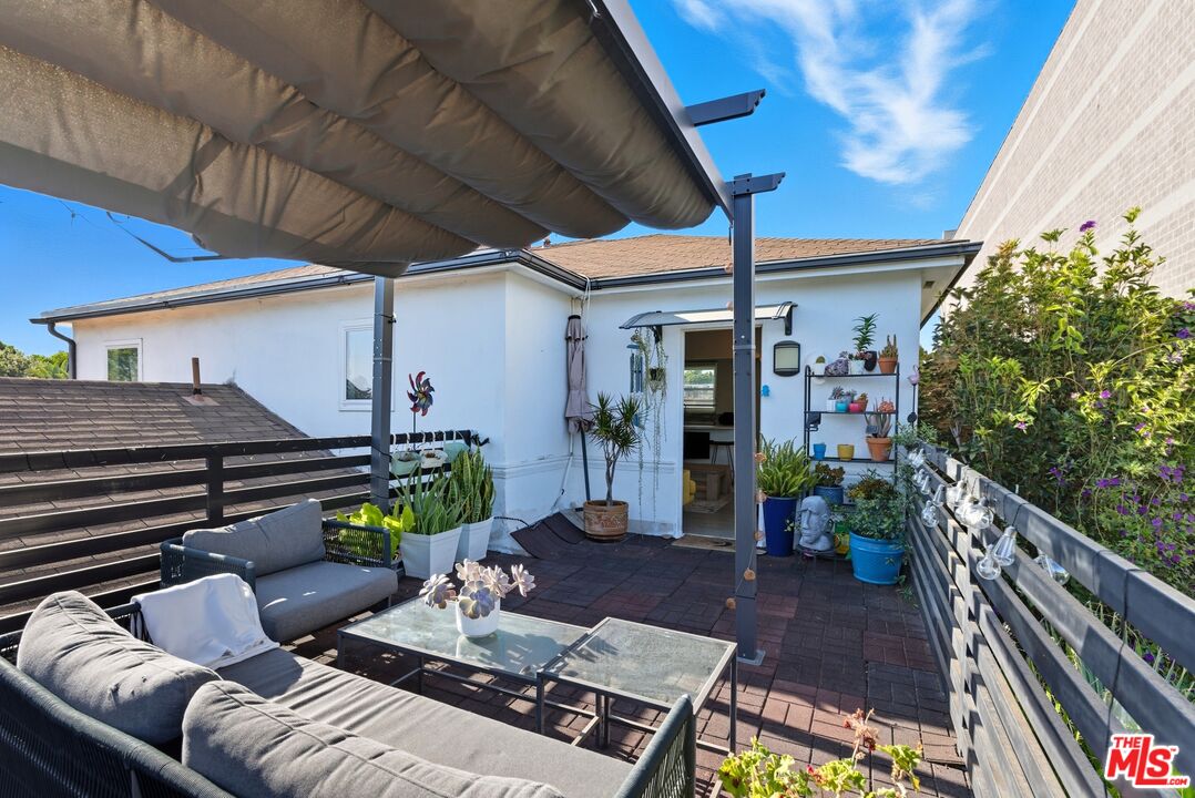 10915 Ayres Avenue Los Angeles, CA 90064 - Photo 39 of 51 a outdoor space with chairs