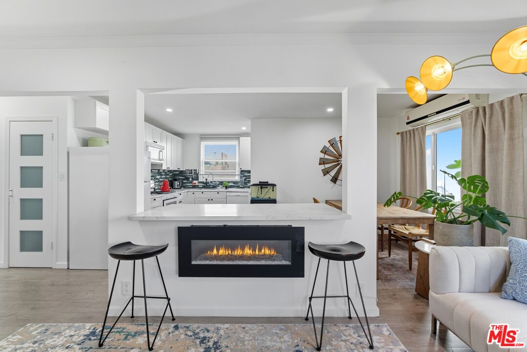10915 Ayres Avenue Los Angeles, CA 90064 - Photo 40 of 51 a living room with furniture and wooden floor