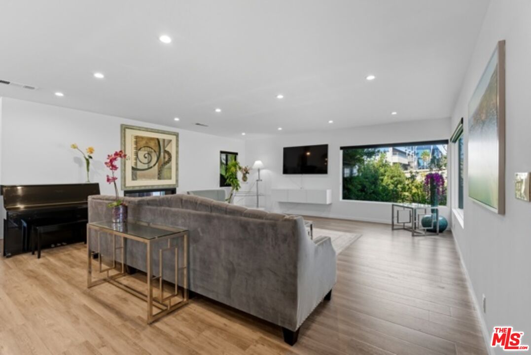 10915 Ayres Avenue Los Angeles, CA 90064 - Photo 6 of 51 a living room with furniture and a flat screen tv