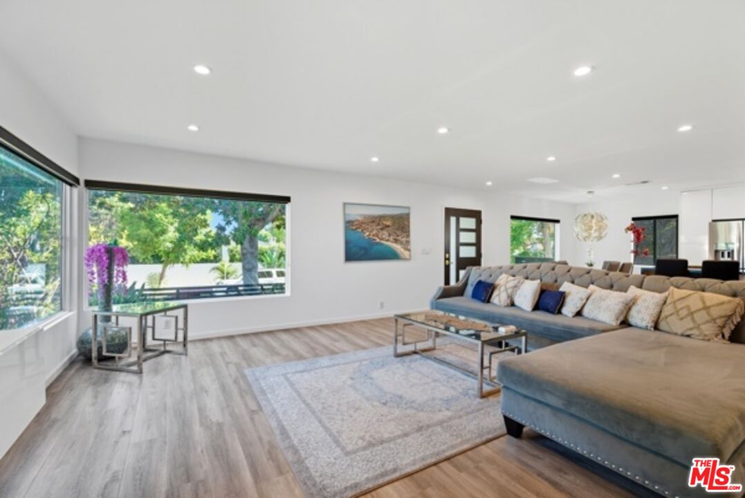 10915 Ayres Avenue Los Angeles, CA 90064 - Photo 7 of 51 a living room with furniture and a large window