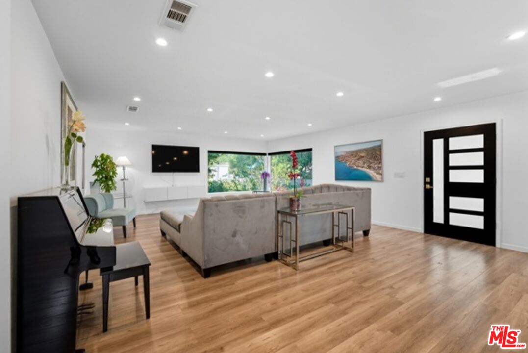 10915 Ayres Avenue Los Angeles, CA 90064 - Photo 8 of 51 a living room with furniture and a wooden floor