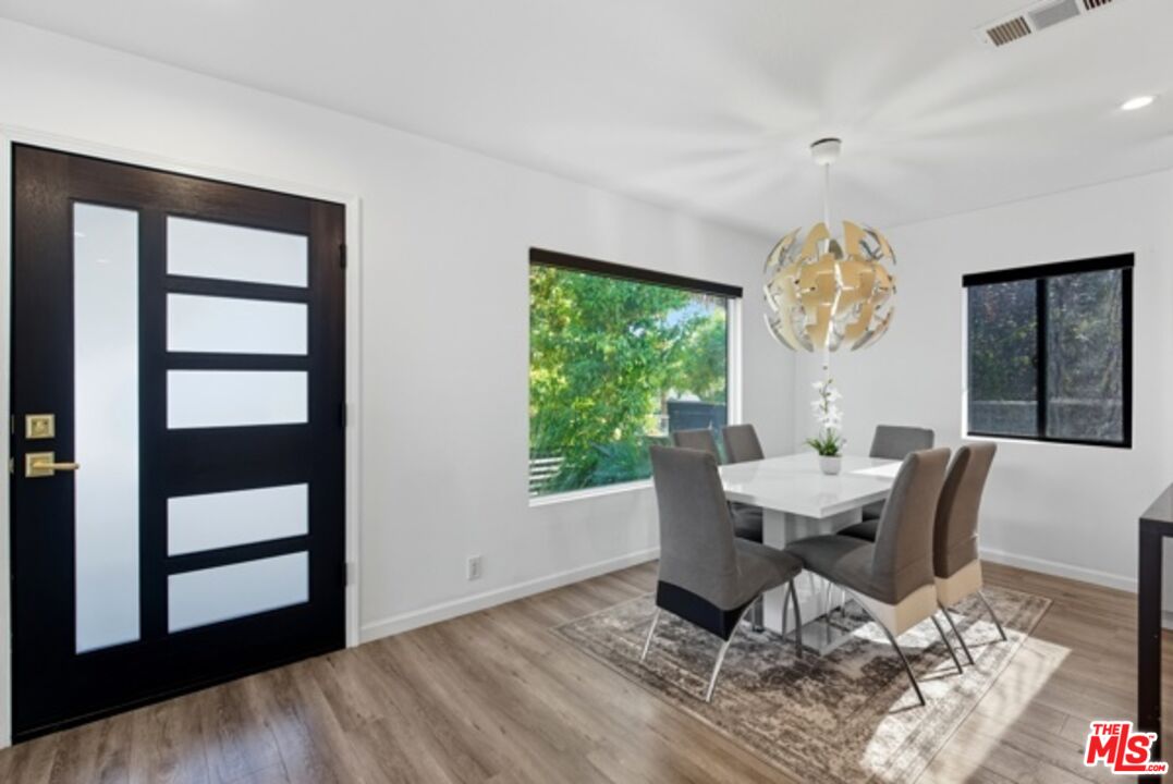 10915 Ayres Avenue Los Angeles, CA 90064 - Photo 9 of 51 a workspace with furniture window and wooden floor