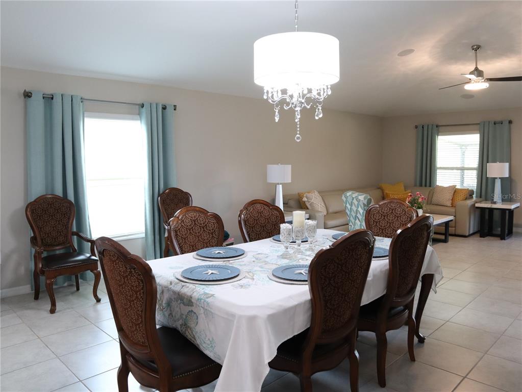 16554 Delia Street Wimauma, FL 33598 - Photo 16 of 44 a view of a dining room with furniture