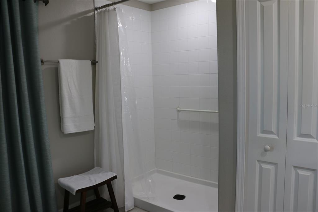16554 Delia Street Wimauma, FL 33598 - Photo 20 of 44 a bathroom with a shower