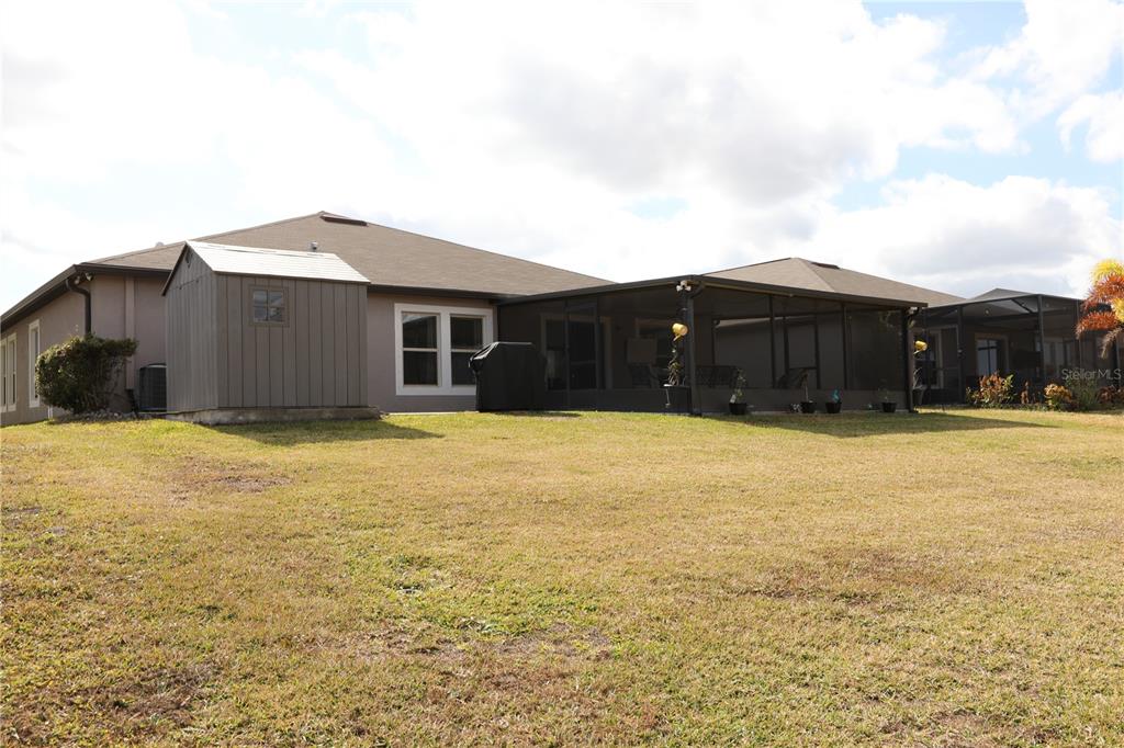 16554 Delia Street Wimauma, FL 33598 - Photo 32 of 44 a house view with a backyard