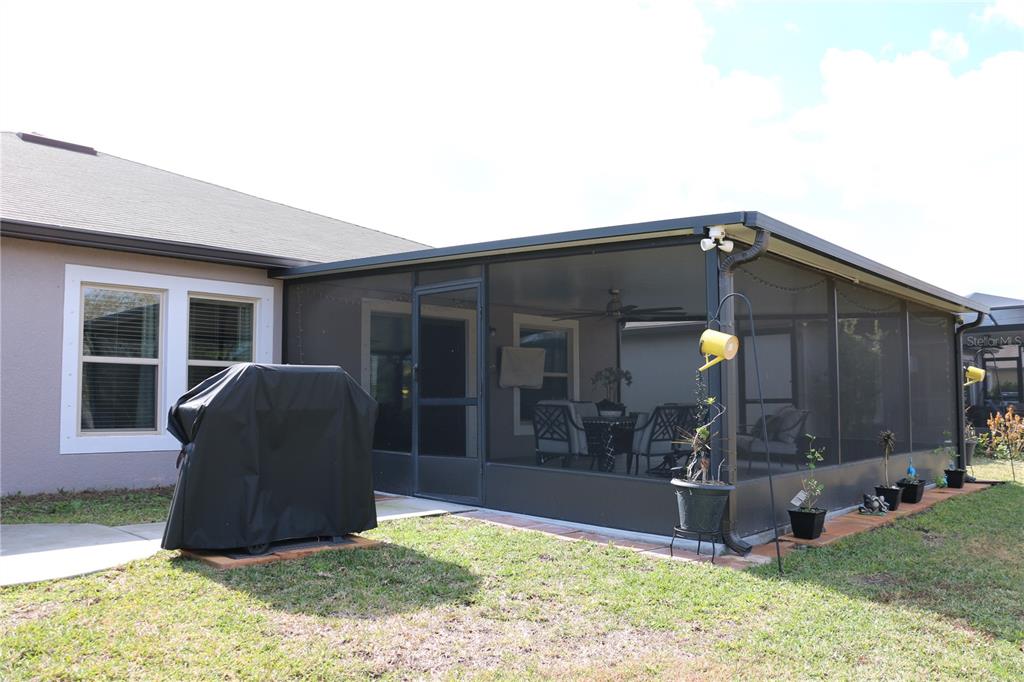 16554 Delia Street Wimauma, FL 33598 - Photo 33 of 44 a house view with a garden space