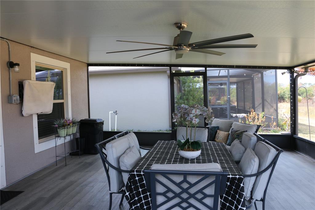 16554 Delia Street Wimauma, FL 33598 - Photo 35 of 44 a view of a dining room with furniture window and outside view