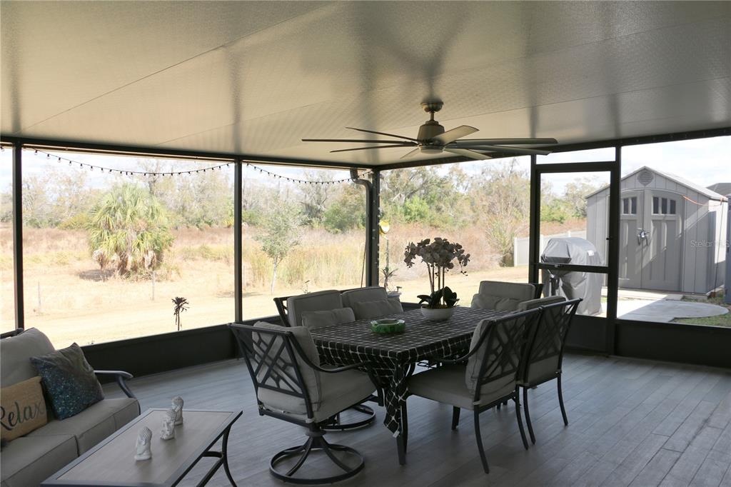 16554 Delia Street Wimauma, FL 33598 - Photo 37 of 44 a view of a dining room with furniture window and outside view