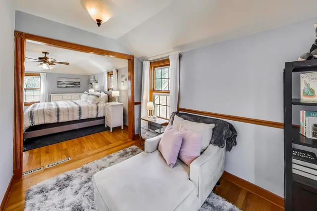 a bedroom with bed and balcony