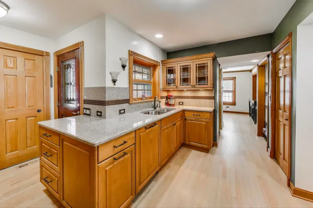 a kitchen with a sink stove and cabinets