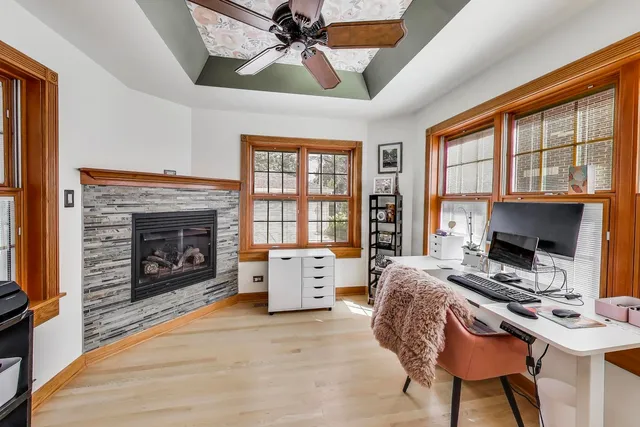 a bedroom with a bed and a fireplace