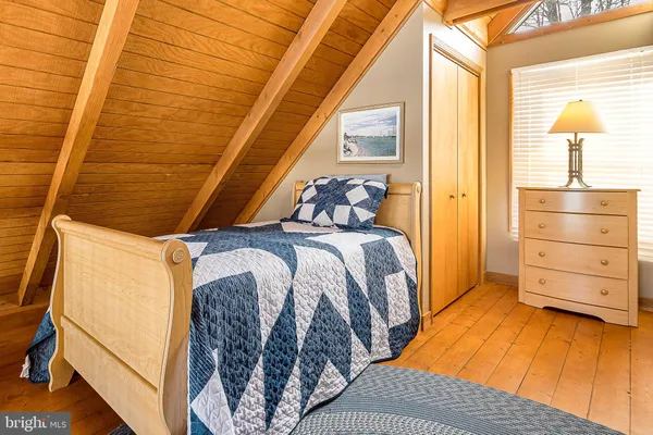 a view of a bedroom with walk in closet