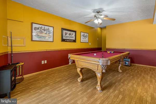a dining room with a table and chairs