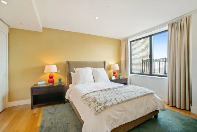 a bedroom with a bed and window