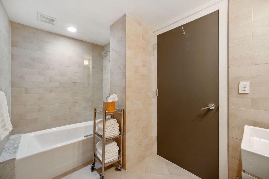 160 Central Park South, Unit 1211 Manhattan, NY 10019 - Photo 4 of 7 a bathroom with a bathtub and a shower