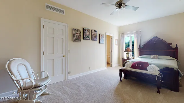 a bedroom with a bed and a desk