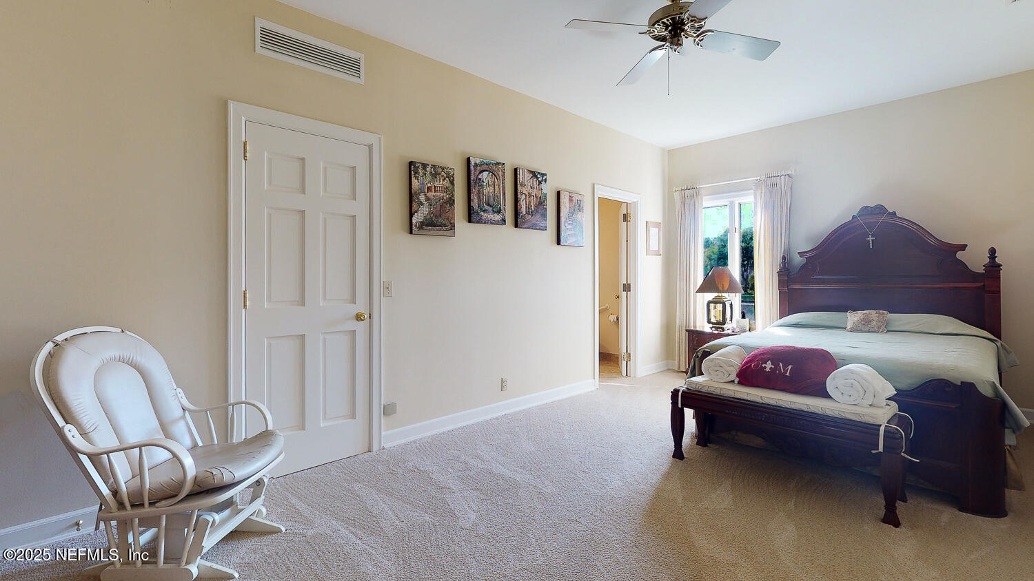 7987 Hollyridge Road Jacksonville, FL 32256 - Photo 12 of 55 a bed room with a bed and a chair