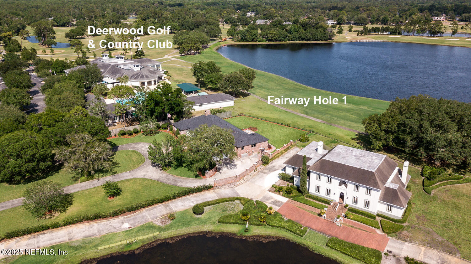 7987 Hollyridge Road Jacksonville, FL 32256 - Photo 27 of 55 an aerial view of a house with a lake view