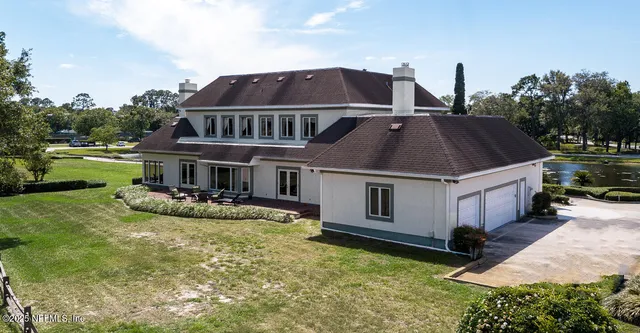 a living room with furniture a table and a fireplace