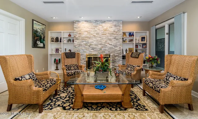 a lobby with furniture and flowers