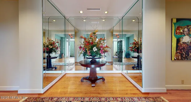 a bedroom with furniture and a rug