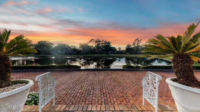 a kitchen with a sink a counter top space and stainless steel appliances