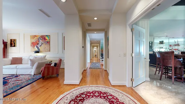 a kitchen with a sink a counter top space and stainless steel appliances