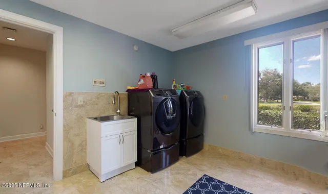 a living room with furniture and a rug