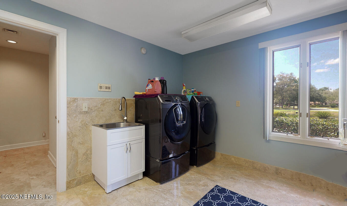 7987 Hollyridge Road Jacksonville, FL 32256 - Photo 42 of 55 a storage room with washer and dryer