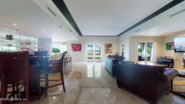 a view of cabinets a wooden floor and a window in a kitchen