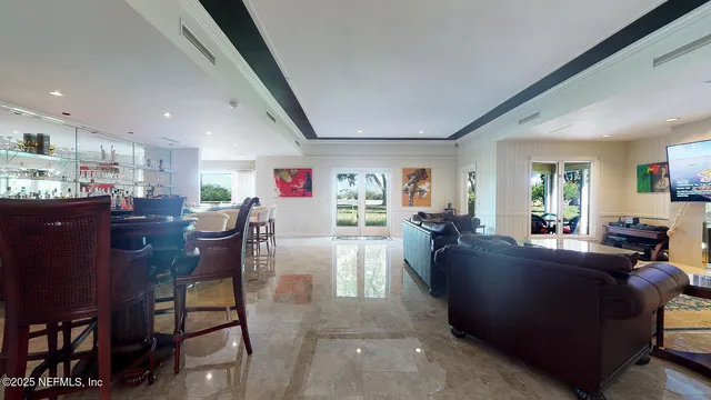 a view of cabinets a wooden floor and a window in a kitchen