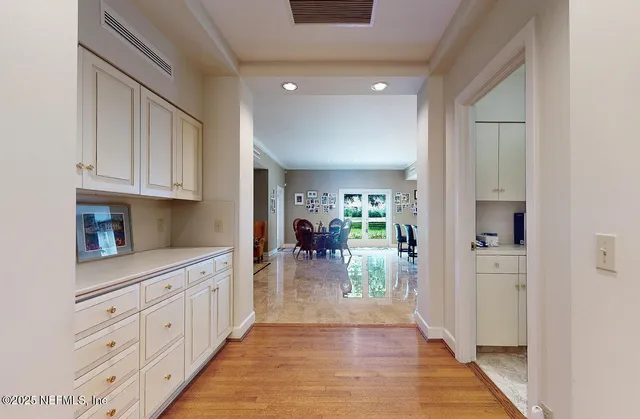 a view of a hallway with a chandelier