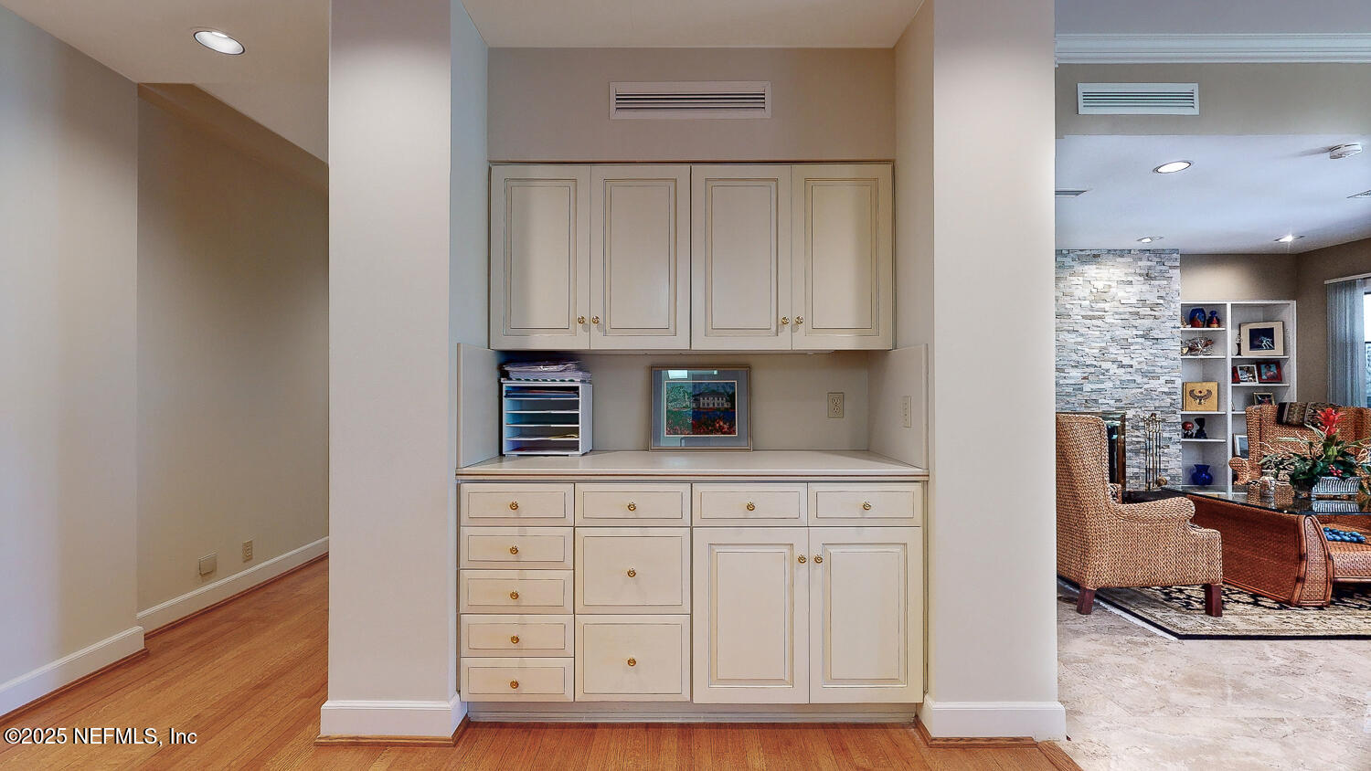 7987 Hollyridge Road Jacksonville, FL 32256 - Photo 49 of 55 a view of cabinets a wooden floor and a window in a kitchen