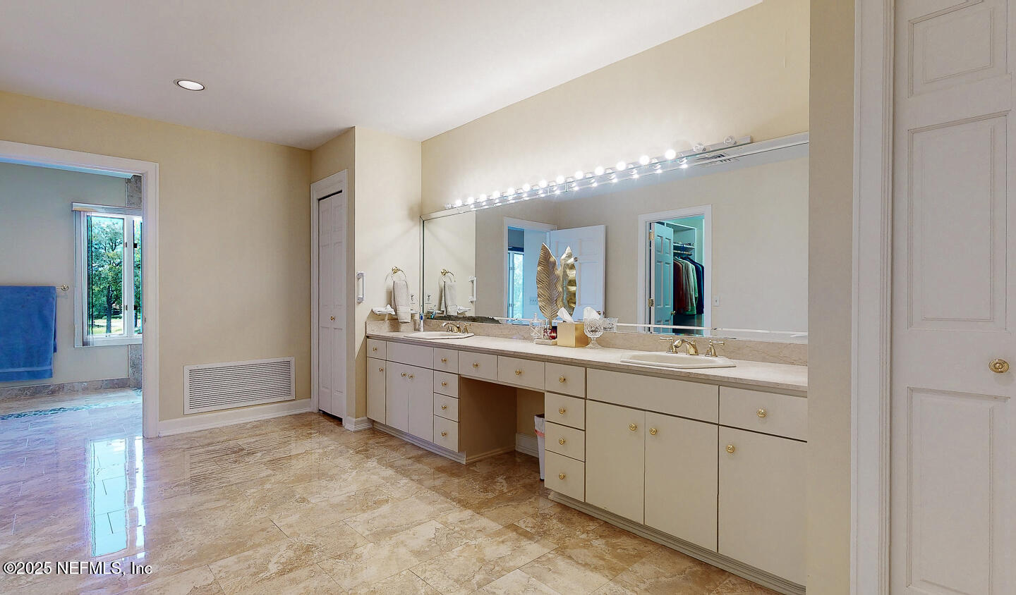 7987 Hollyridge Road Jacksonville, FL 32256 - Photo 6 of 55 a spacious bathroom with a granite countertop sink mirror and a