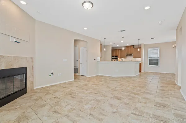 a view of a kitchen with a sink and a refrigerator