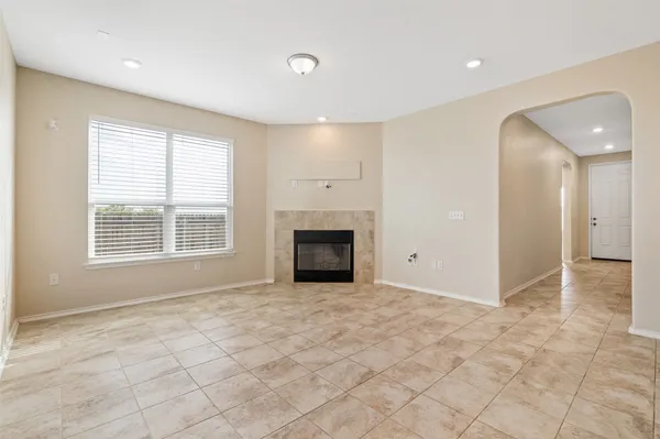 a view of a kitchen with a sink and a fireplace