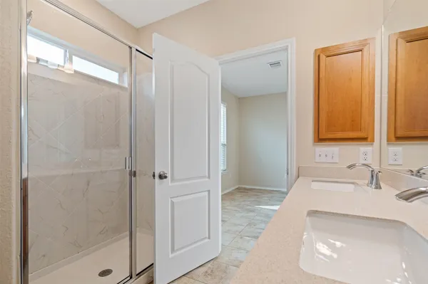 a bathroom with a granite countertop sink a toilet and a mirror