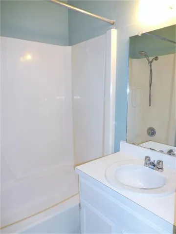 a view of a house with a yard and garage