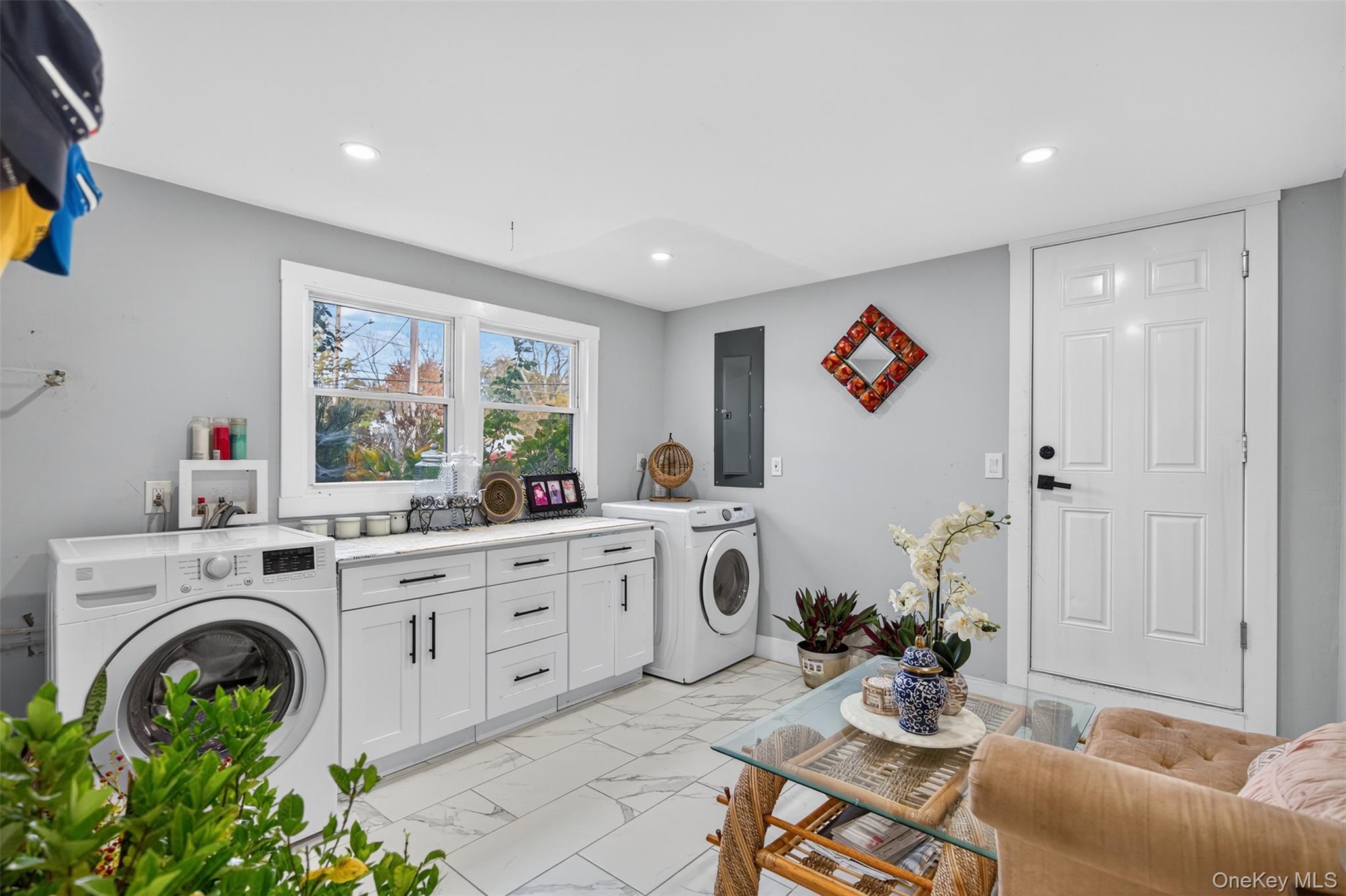 88 Spackenkill Road Poughkeepsie, NY 12603 - Photo 11 of 22 a living room with furniture a rug and a open kitchen view