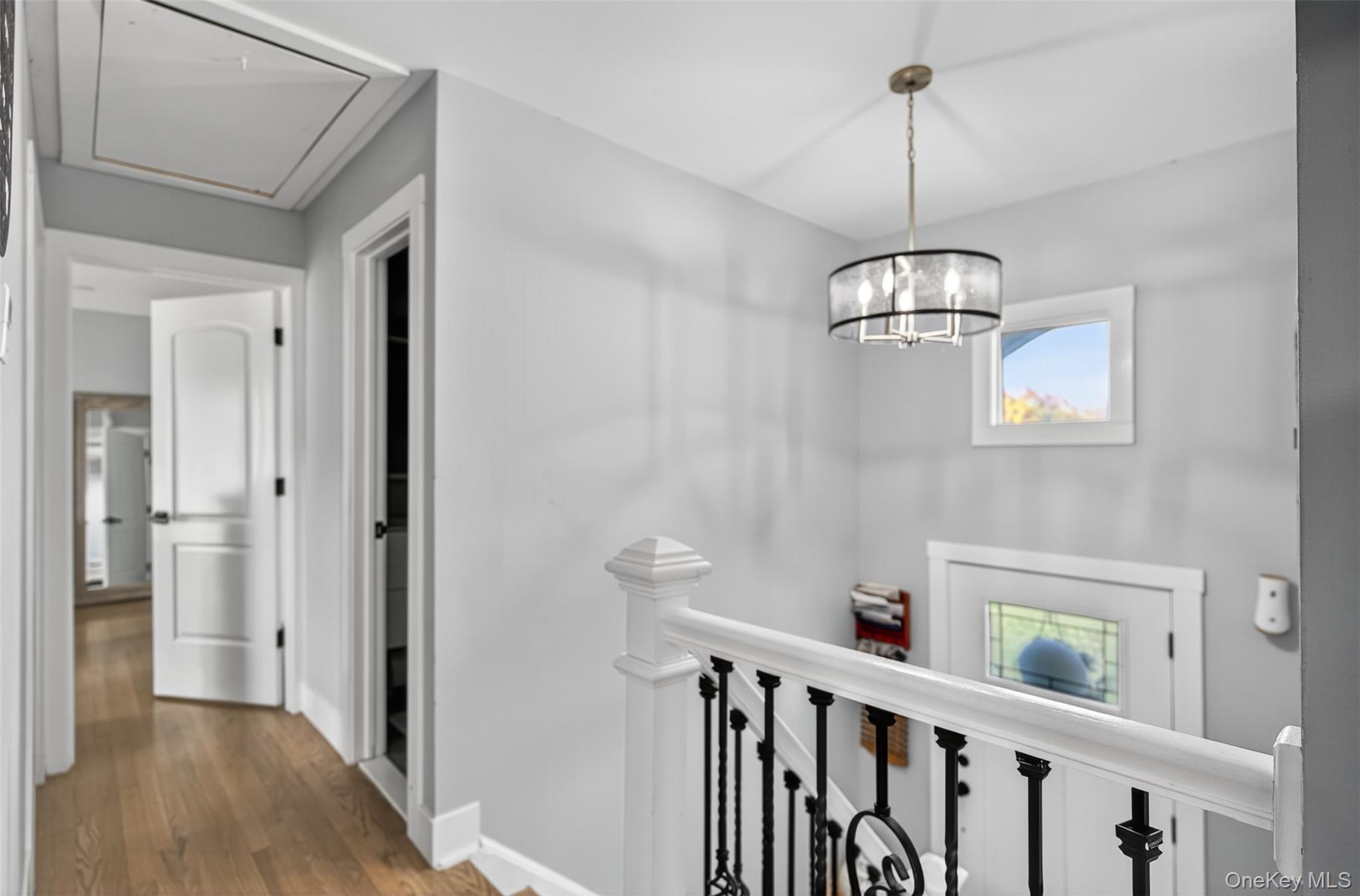 88 Spackenkill Road Poughkeepsie, NY 12603 - Photo 12 of 22 a view of a hallway with a chandelier