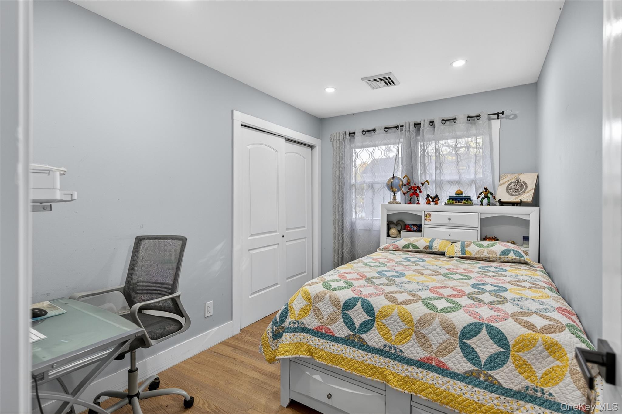 88 Spackenkill Road Poughkeepsie, NY 12603 - Photo 14 of 22 a bedroom with a bed a desk and chair